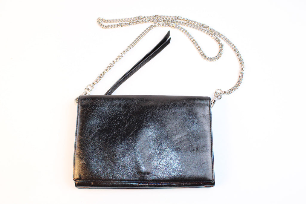 AllSaints black leather zip clutch with chain strap