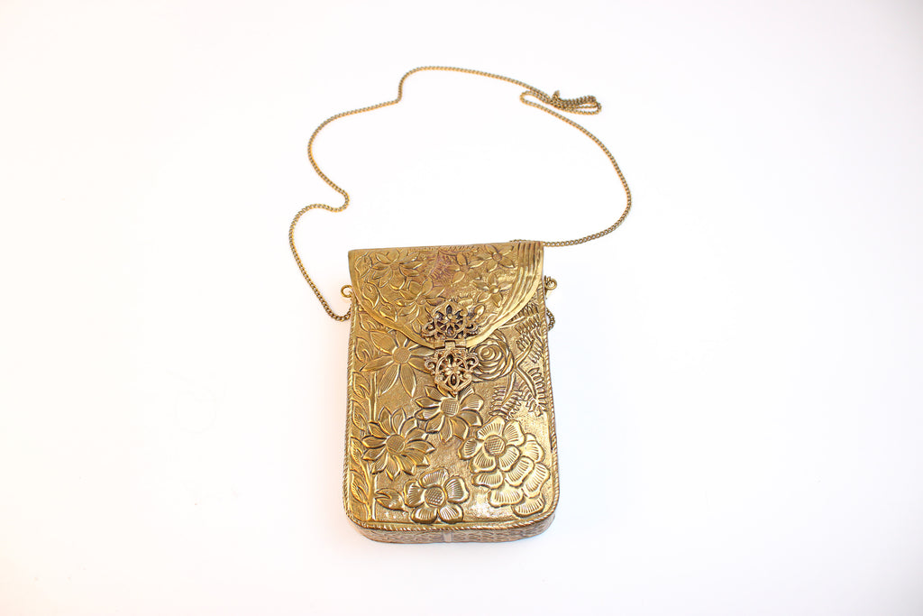 From St Xavier gold embossed floral metal mini crossbody evening bag with chain stra