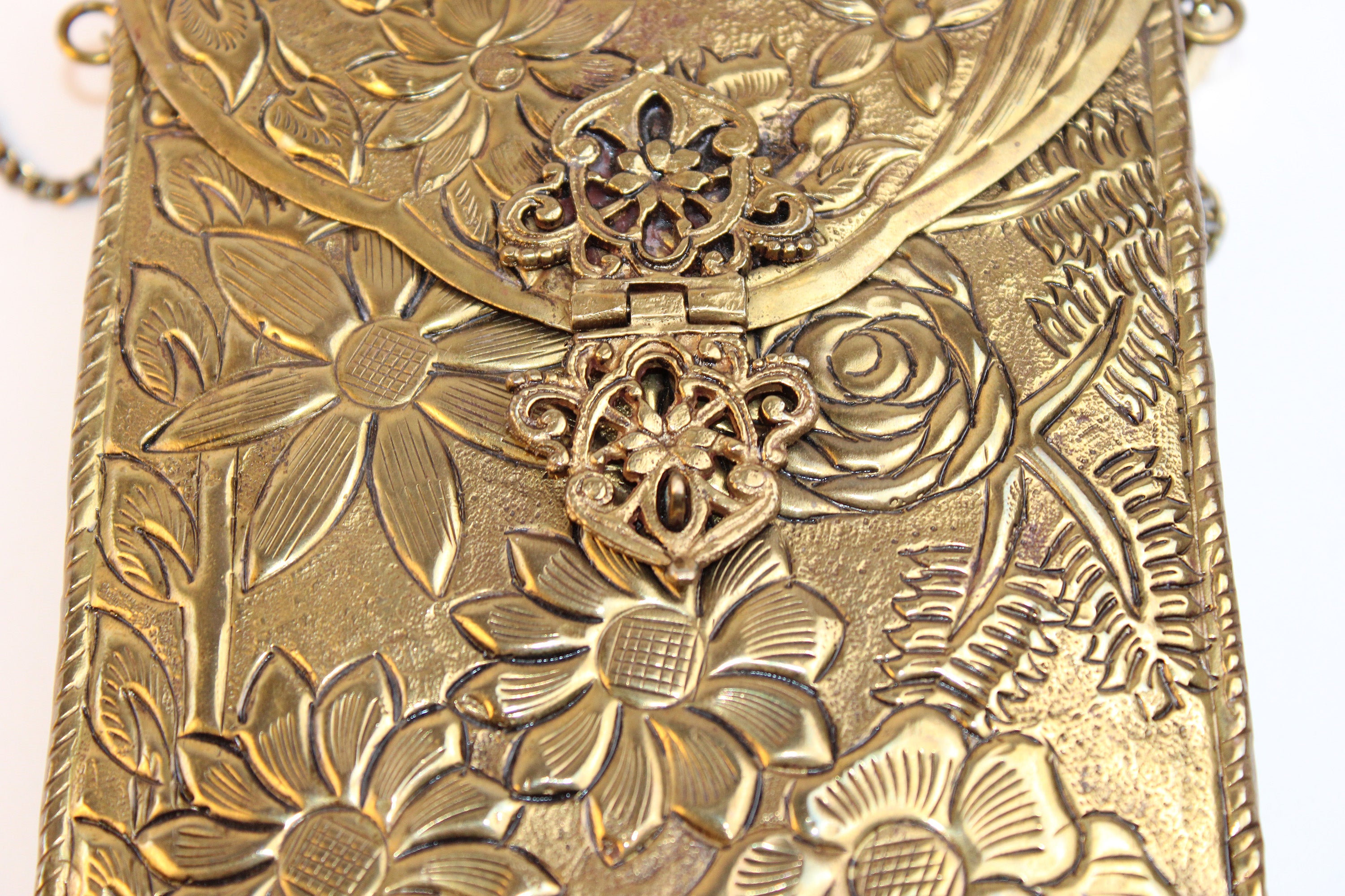 From St Xavier Gold Embossed Floral Mini Crossbody Bag