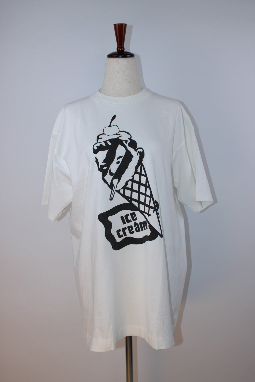 White Ice Cream graphic T-shirt featuring the brand's signature black melting ice cream cone print on the front with logo detail on the back neckline.