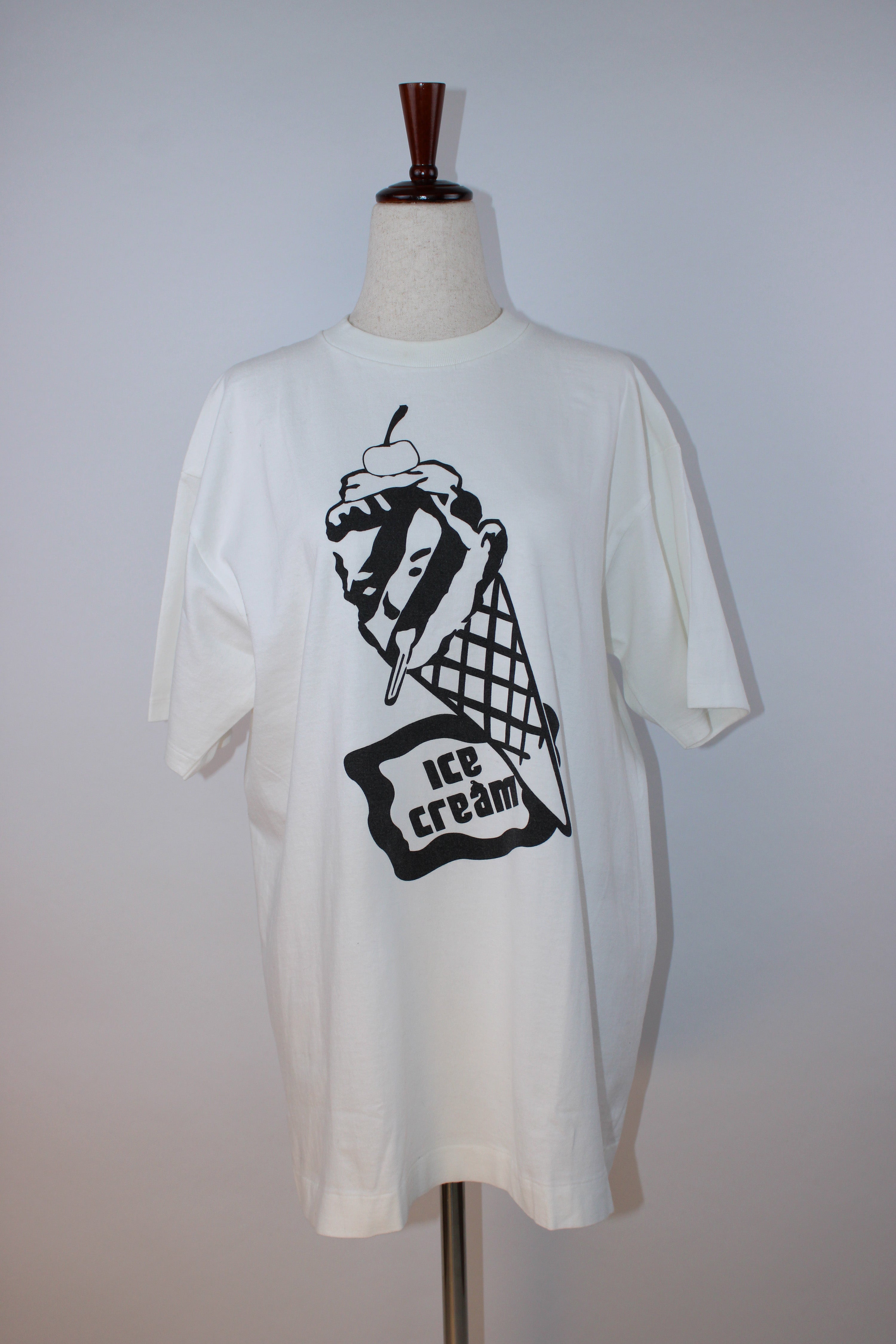 White Ice Cream graphic T-shirt featuring the brand's signature black melting ice cream cone print on the front with logo detail on the back neckline.