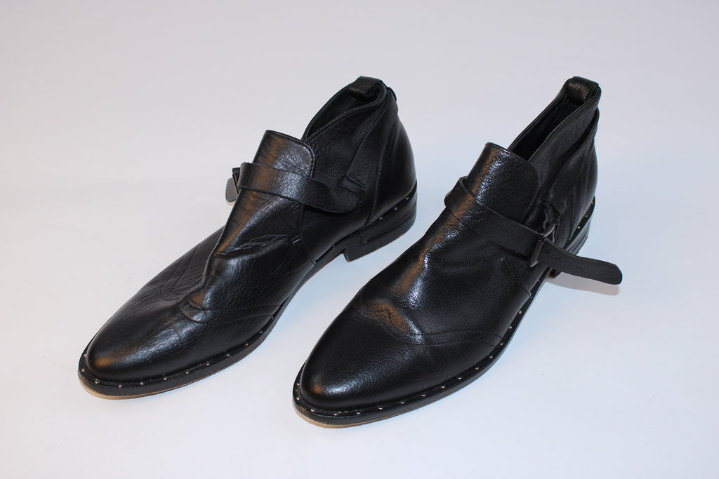 Freda Salvador black leather buckle oxford flats with studded welt detailing displayed on a white background.