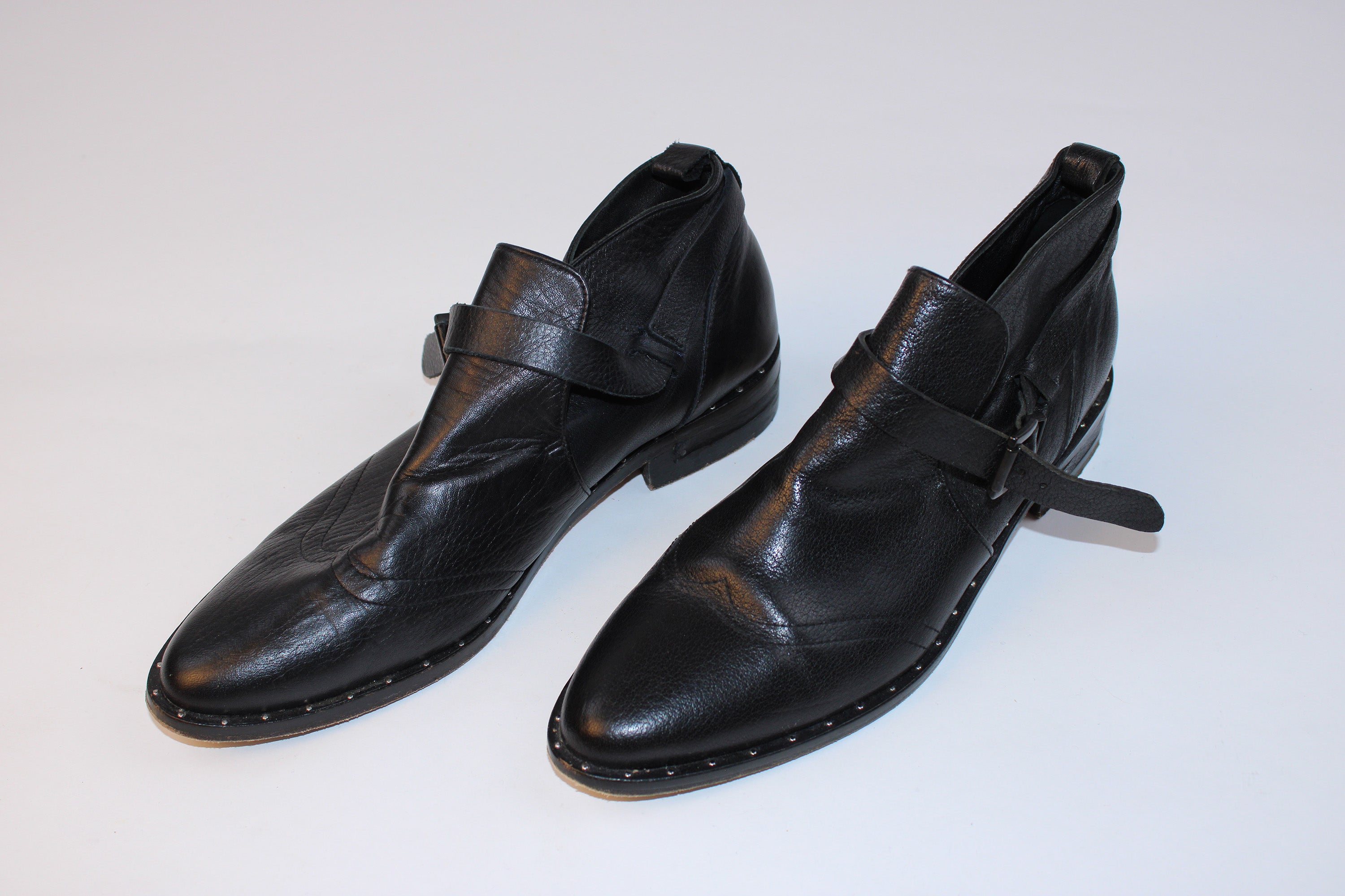 Freda Salvador black leather buckle oxford flats with studded welt detailing displayed on a white background.